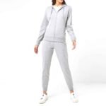 Women’s fleece tracksuit set featuring a zip-up jacket and matching pants, perfect for casual or active wear.