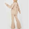 Tailored women’s tracksuit in Terry fleece offering plush comfort and breathable design.