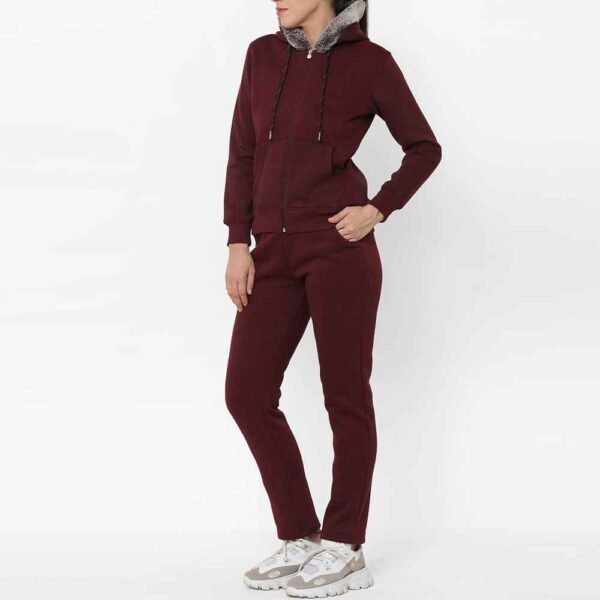 Full view of women fleece tracksuit, including a zip-up hoodie and fitted pants, offering both style and comfort.