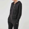 Close-up of a women’s zip-up fleece tracksuit set with stylish pants, offering a comfortable and chic look.