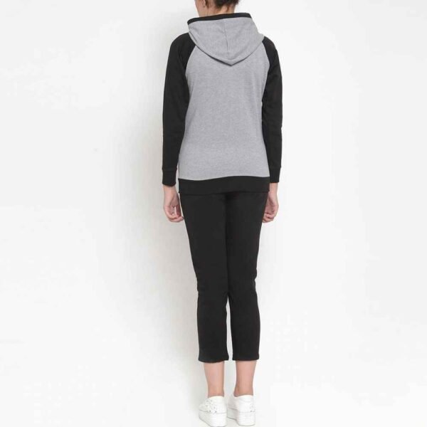 Women’s tracksuit set with zip-up fleece jacket and pants, showing off a perfect blend of comfort, style, and versatility.