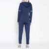 Women fleece tracksuit featuring a zip-up top and matching pants, designed for active and casual wear with a modern touch.