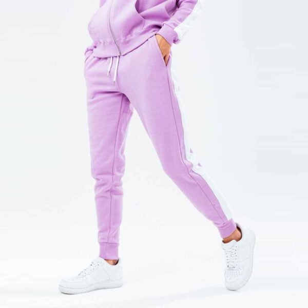 Women’s fleece tracksuit featuring a zip-up jacket and pants, showcasing a modern, sporty style perfect for casual outings.