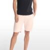 Men’s cotton sweatshorts in a relaxed fit, shown on model wearing casual sneakers.