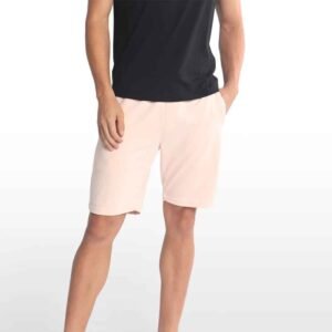 Men’s cotton sweatshorts in a relaxed fit, shown on model wearing casual sneakers.