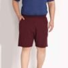 Customizable men’s cotton sweatshorts with side pockets, featured in a studio background.