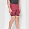 Angled view of men’s cotton shorts, revealing drawstring and side seam detailing.