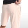 Side angle view of men’s cotton sweatshorts, showcasing pocket placement and relaxed fit.