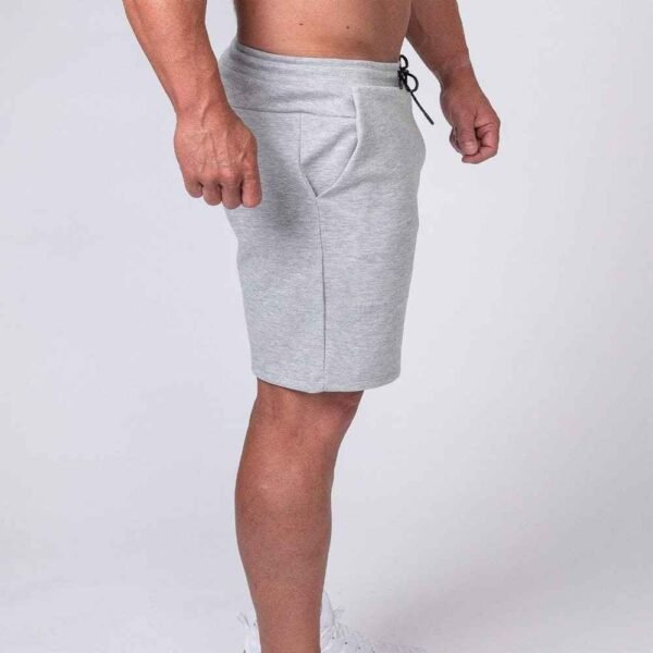 Model wearing custom French Terry cotton shorts in a relaxed fit, styled for casual everyday wear.