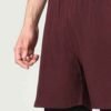 Close-up side shot of men’s casual sweatshorts, focusing on stitching and fabric texture.